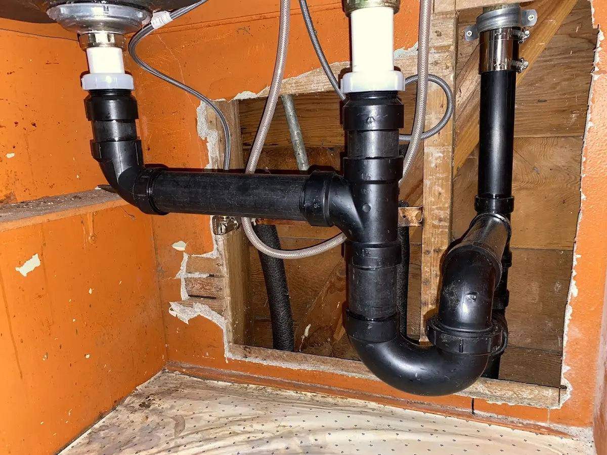 Professional Garbage Disposal Repair equipment and tools on the job in Greensboro